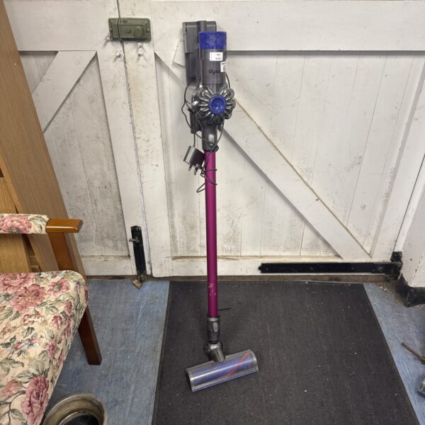 Purple Dyson V6 Absolute cordless vacuum cleaner on display.