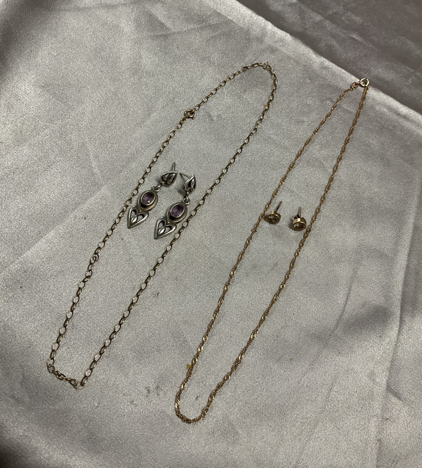 Two 9ct gold chain necklaces 3.63g and two pairs silver earrings