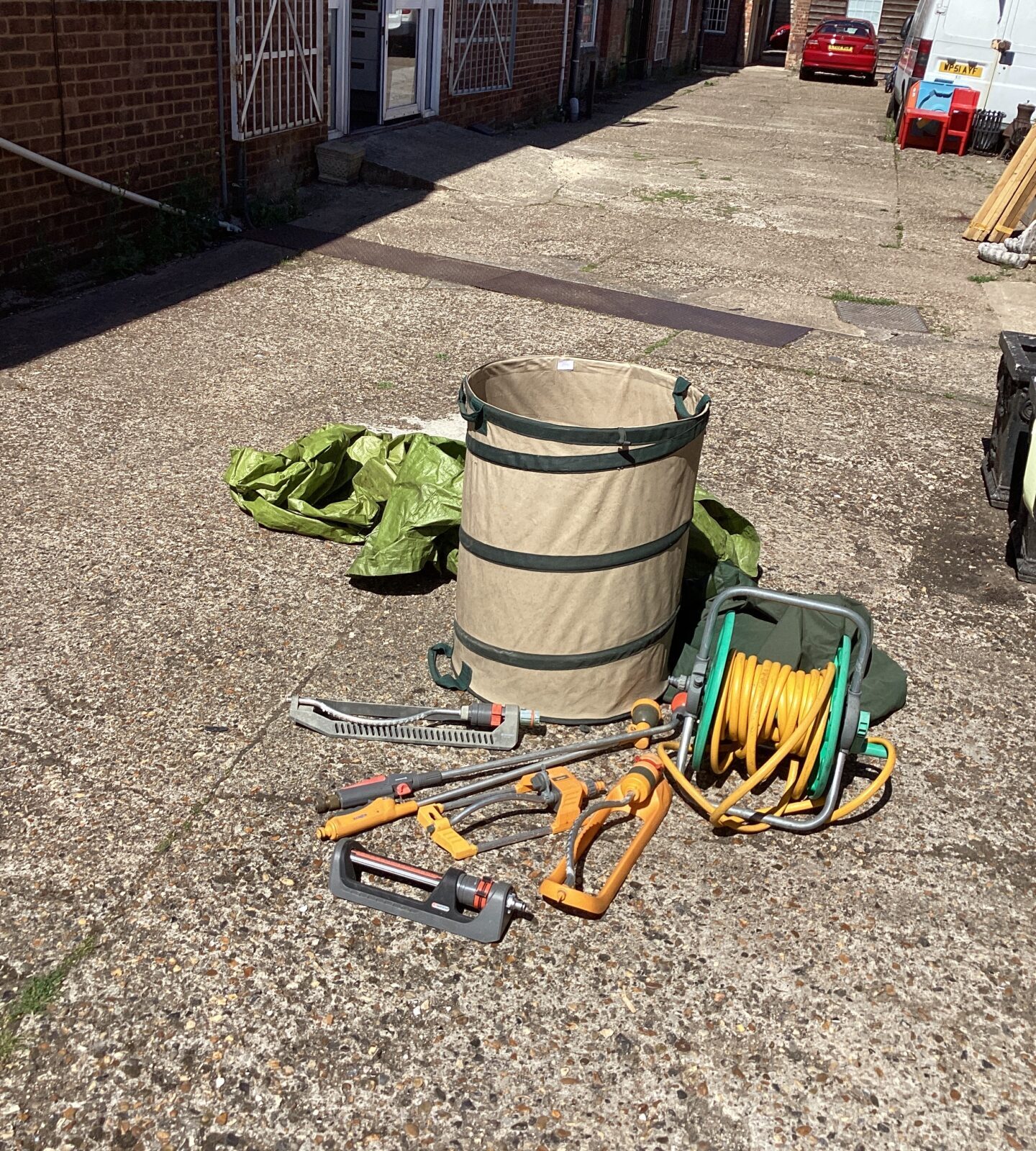 Quantity of garden watering sprinklers, hose and leaf bags