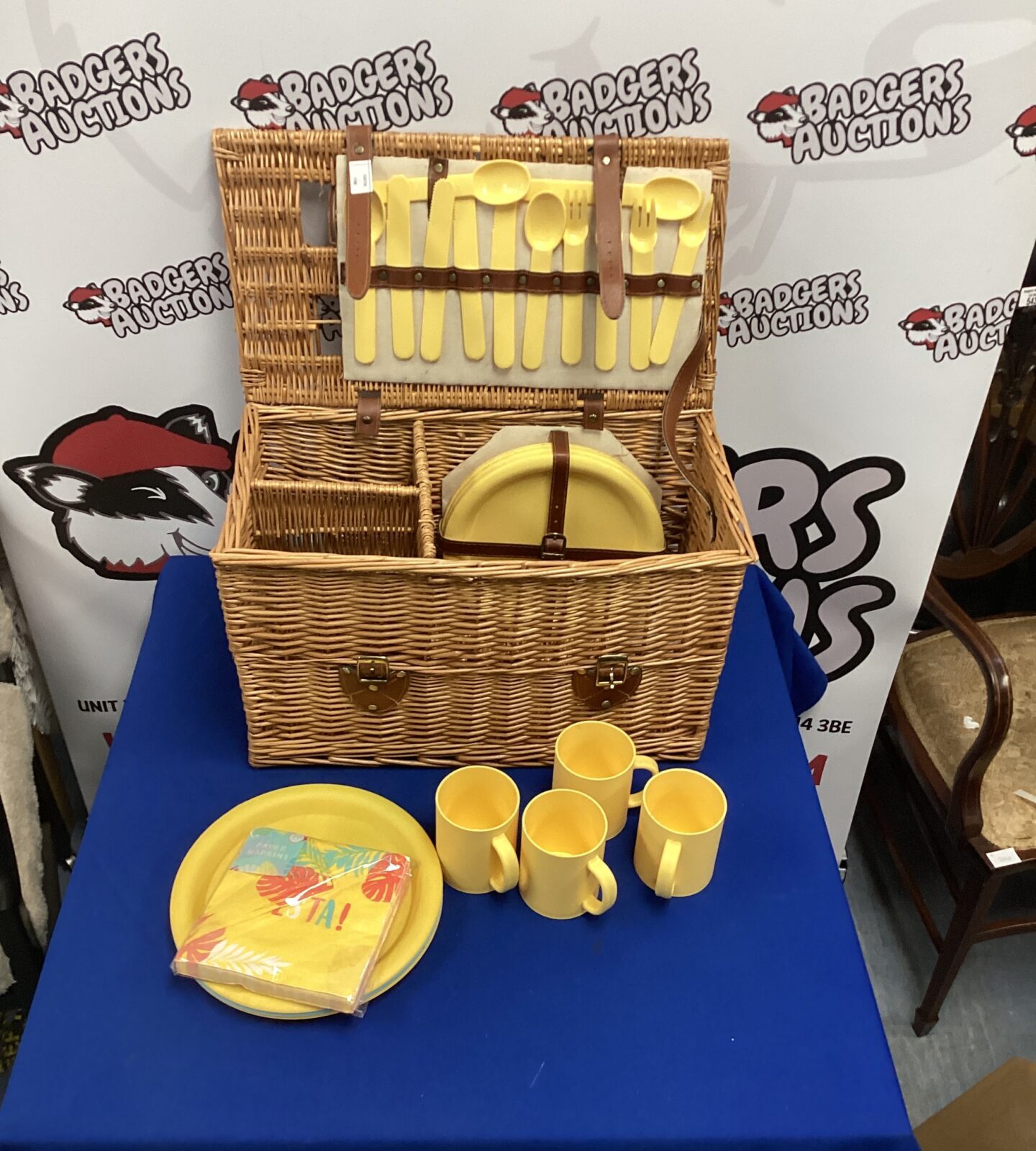 Wicker picnic basket with contents