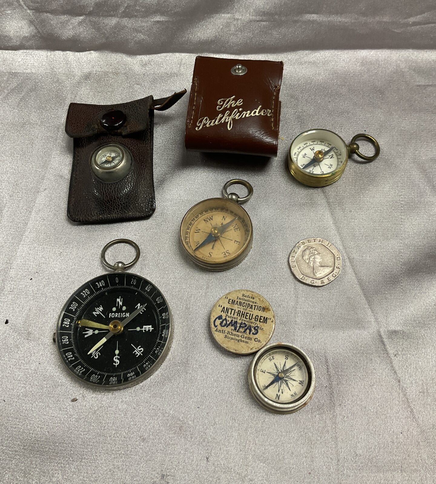 Five vintage pocket compasses
