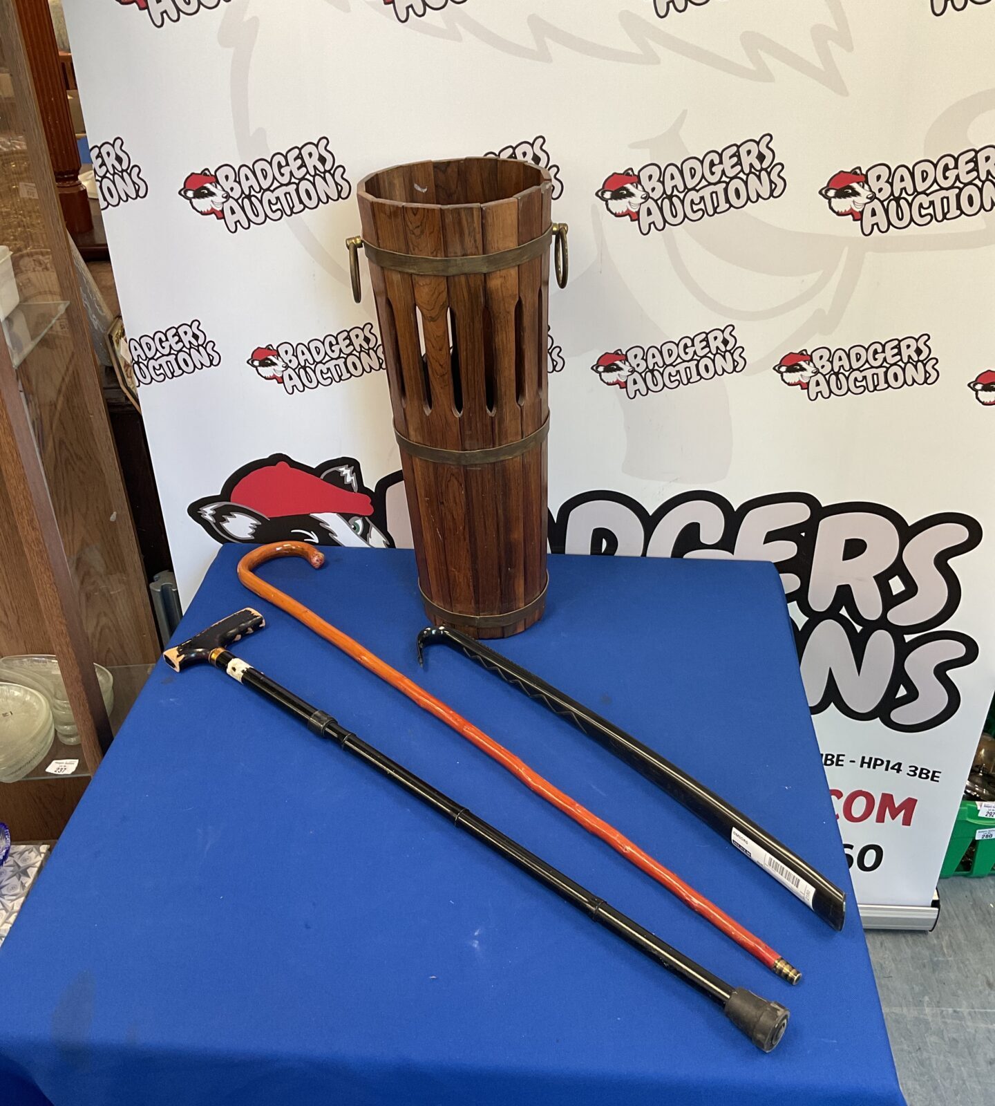 Wooden banded stick stand & walking sticks