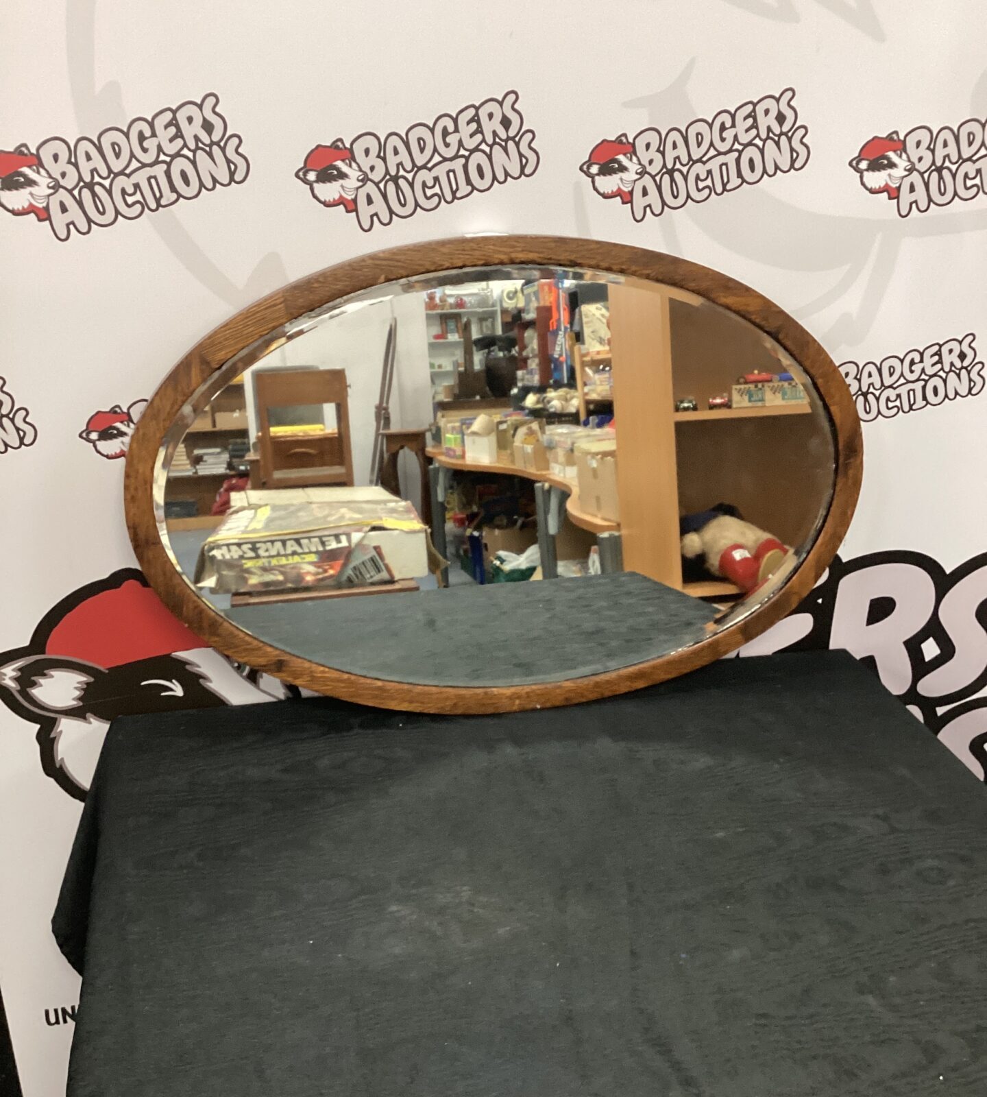 Wooden framed oval mirror