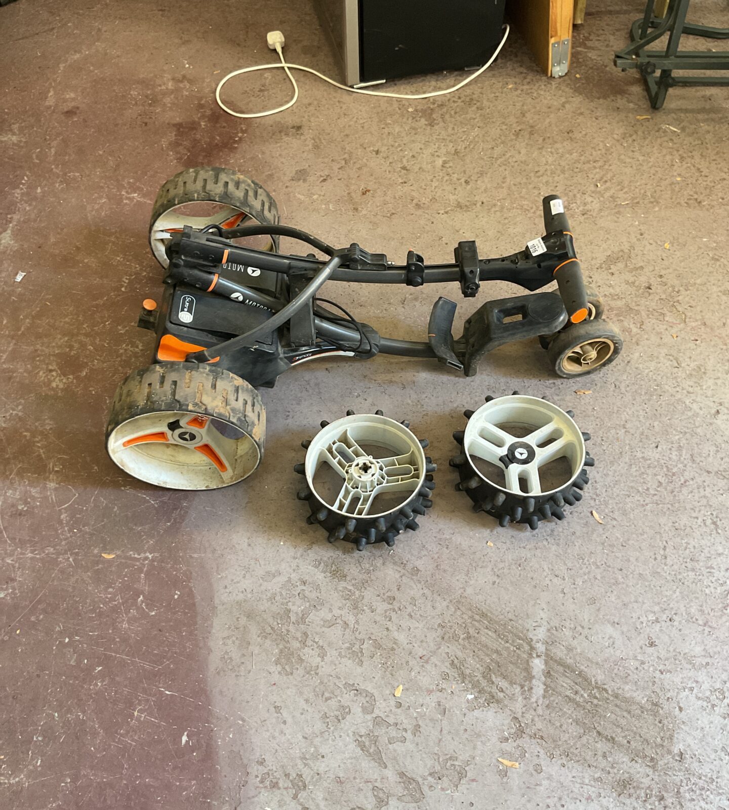 Motocaddy electric golf trolley with spare wheels