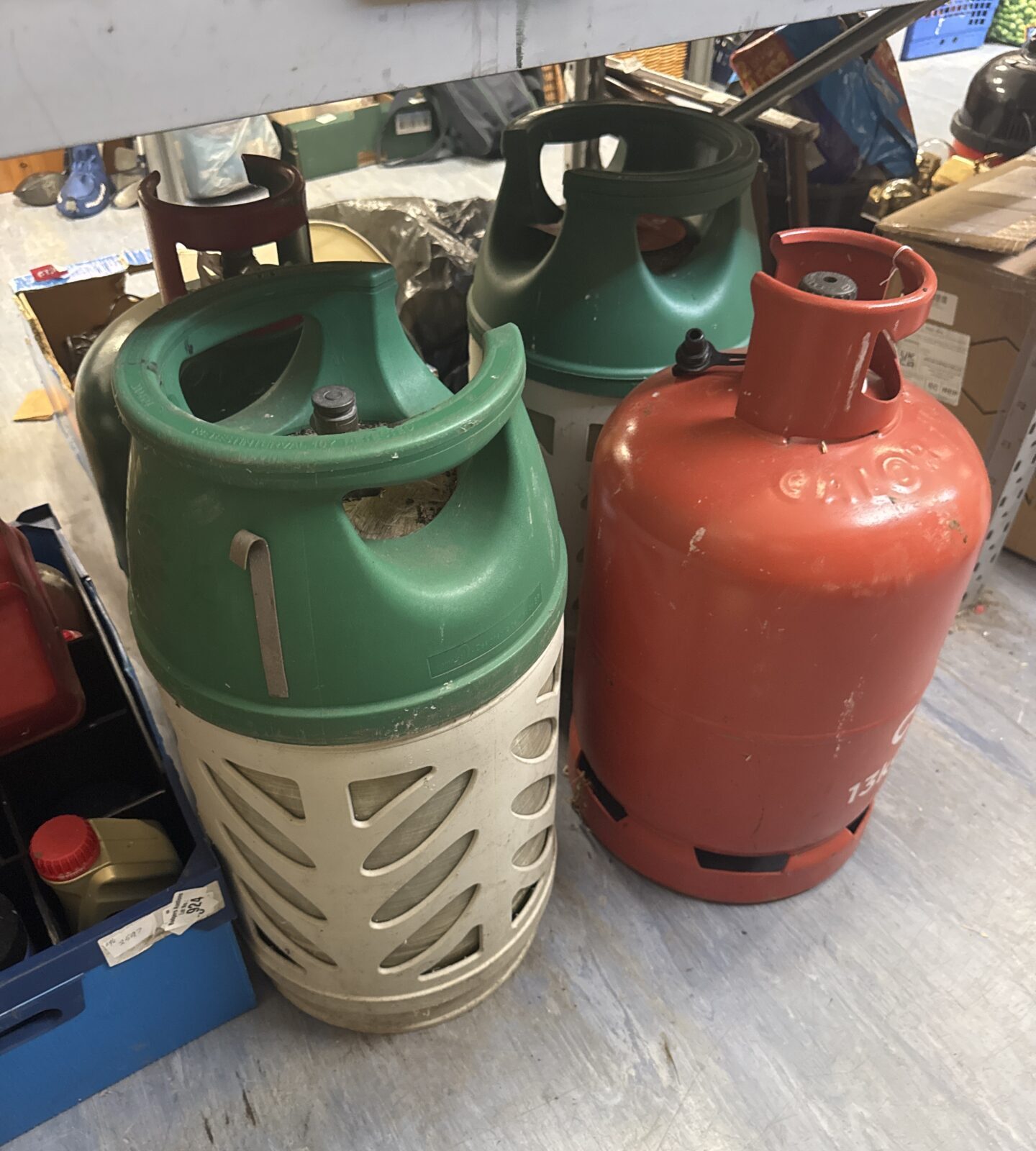 Four patio gas bottles - 2 feel like have contents