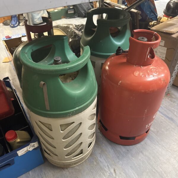 Four patio gas bottles - 2 feel like have contents
