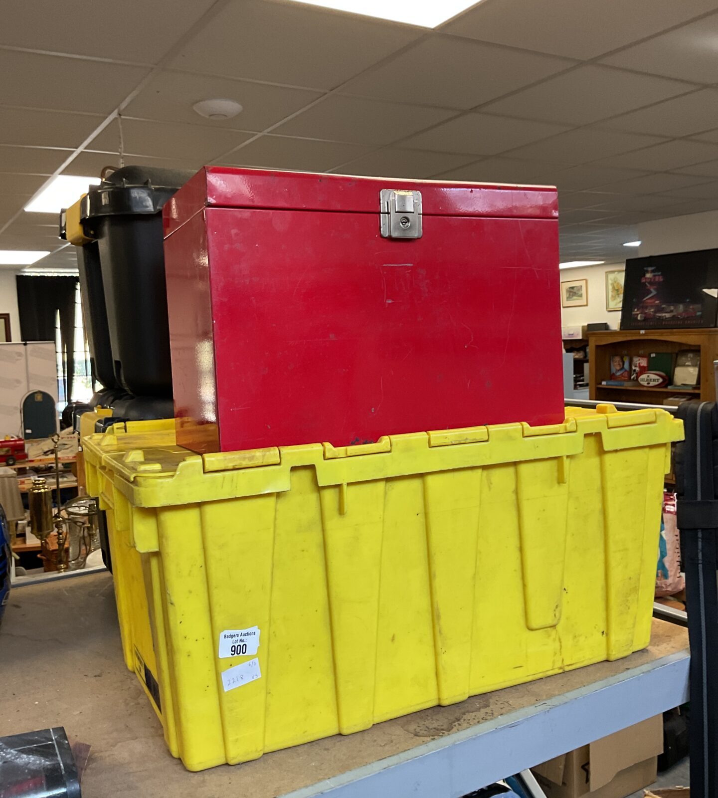 Yellow plastic storage crate with metal toolbox