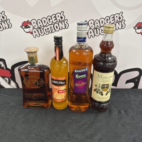 Four bottles of alcohol including amaretto & others