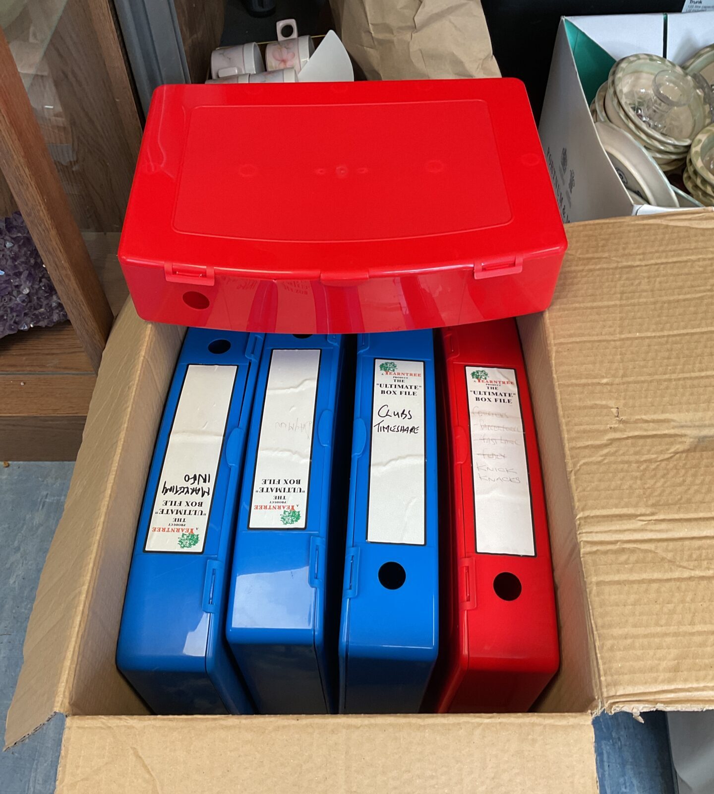 Five plastic box files