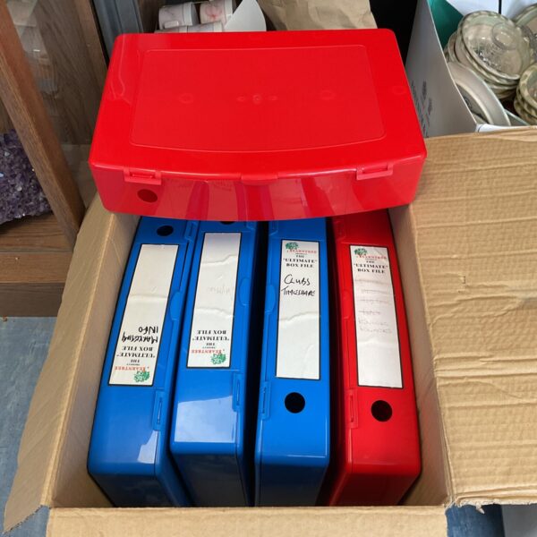Five plastic box files