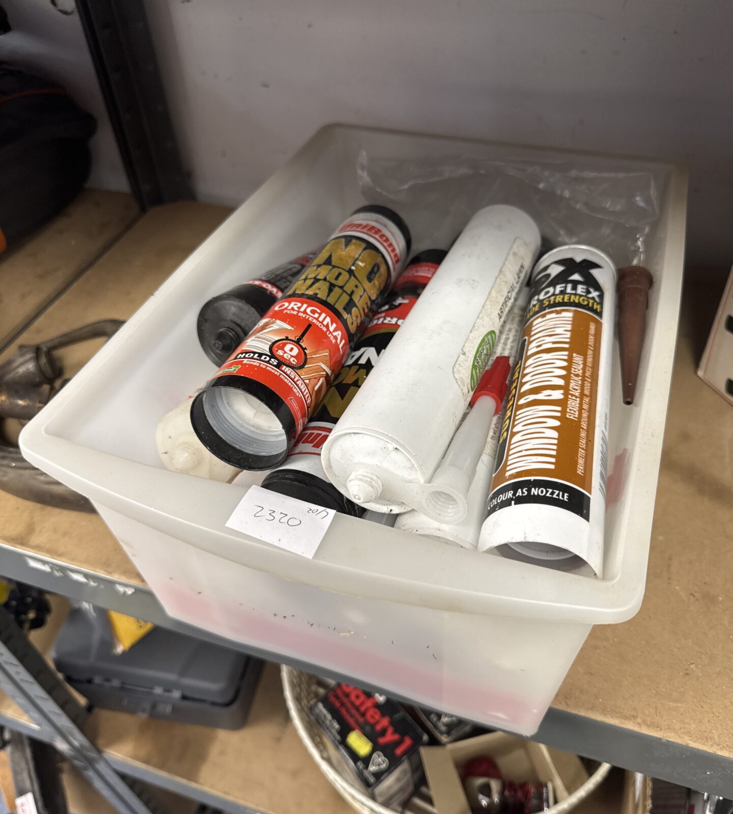 Box of assorted adhesive & sealant tubes