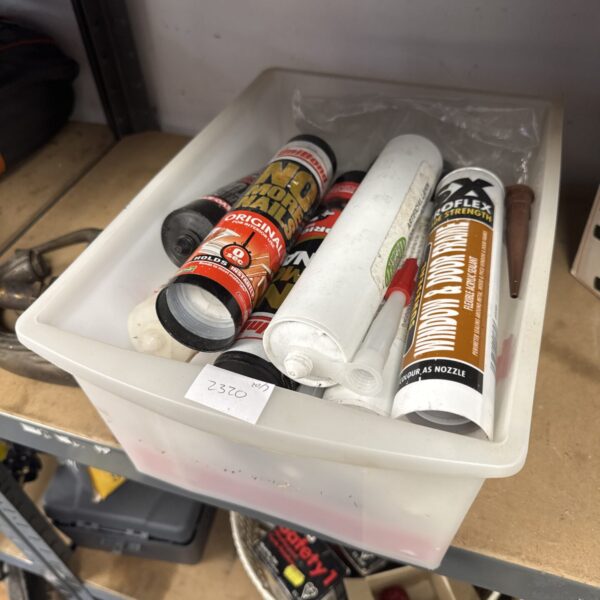 Box of assorted adhesive & sealant tubes