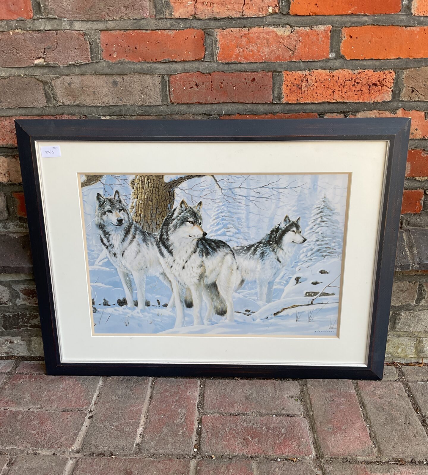 A Fernandez framed print of a wolf pack