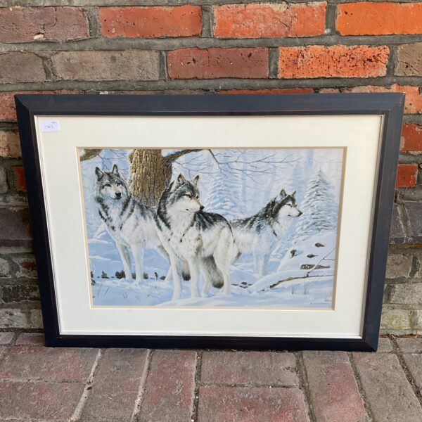 A Fernandez framed print of a wolf pack