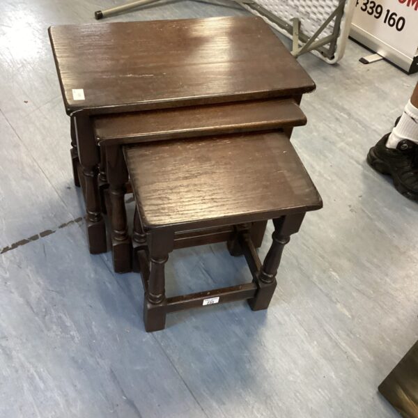 Nest of dark wood tables