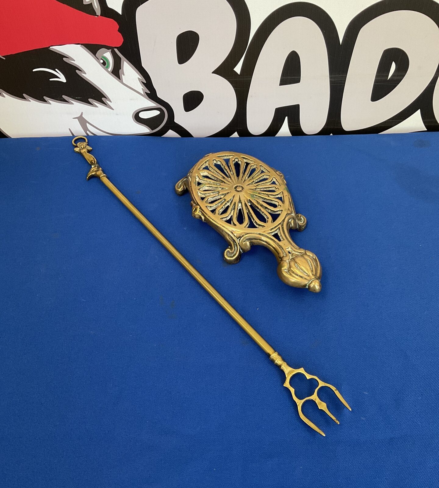 Antique brass trivet with toasting fork