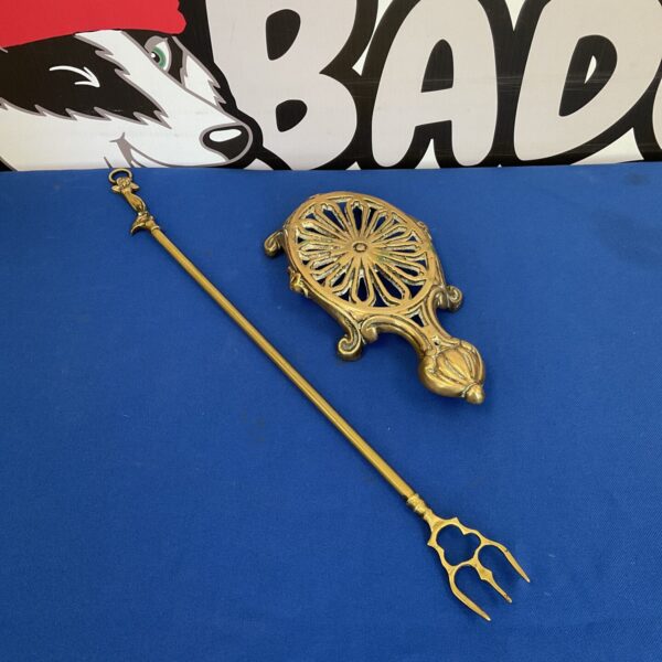 Antique brass trivet with toasting fork
