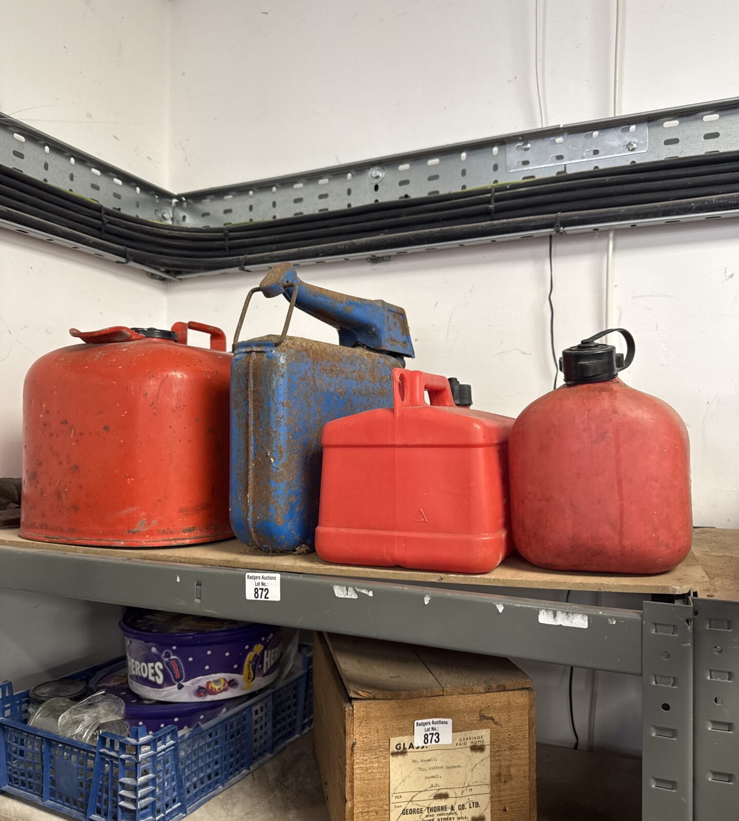 Four petrol cans inc Johnson marine, eversure & two plastic