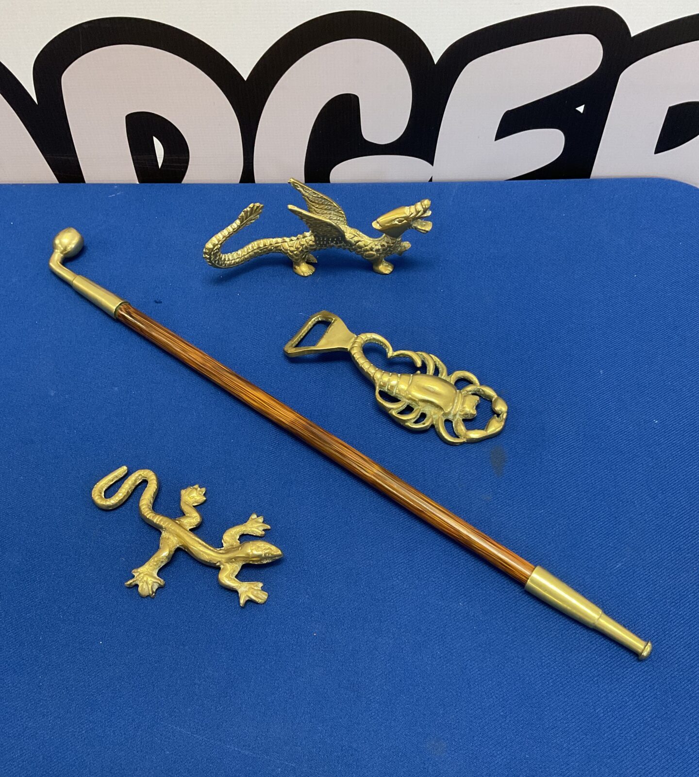Vintage brass pipe with dragon, lizard & scorpion bottle opener