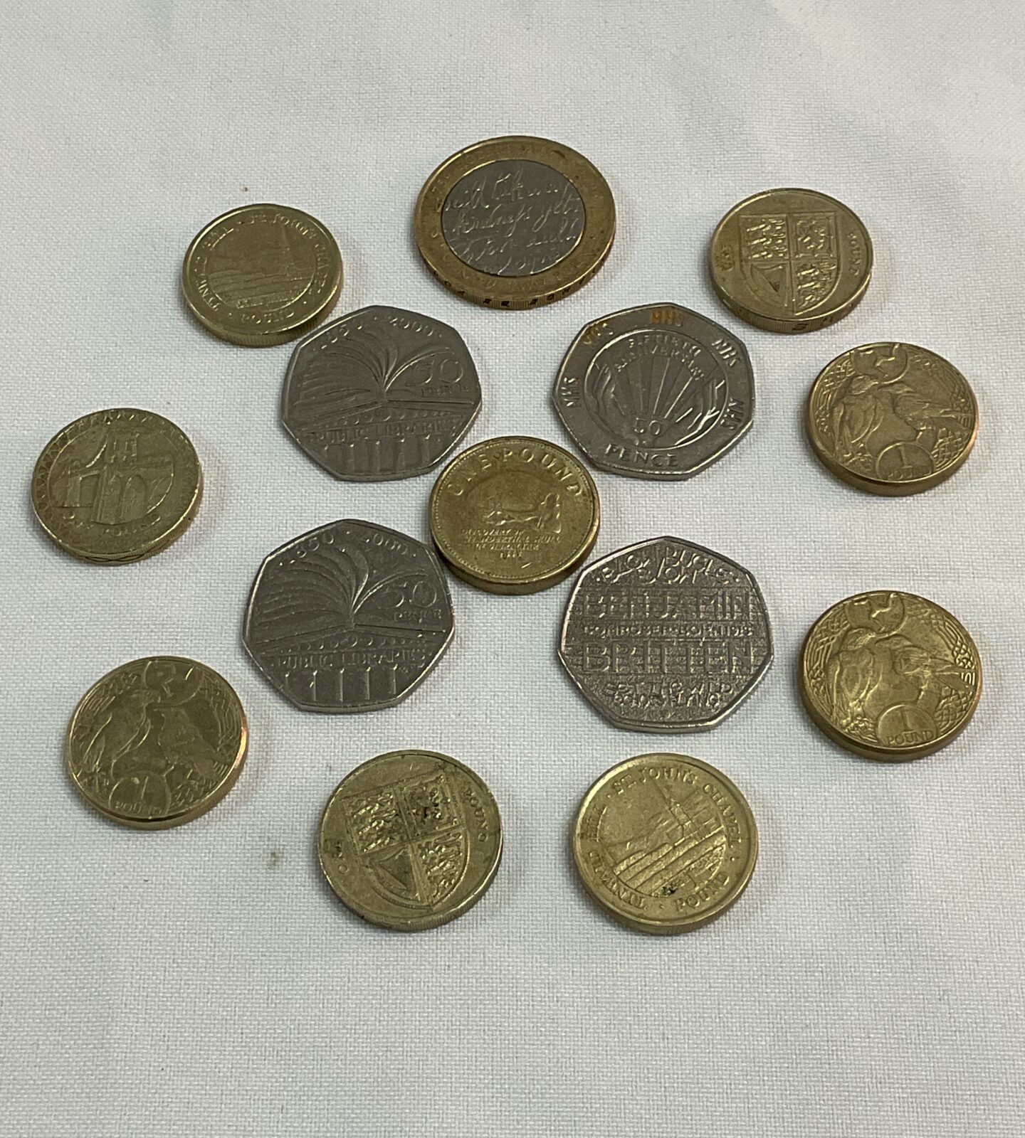 two pound coin nine one pound coins and four fifty pence commemorative coins