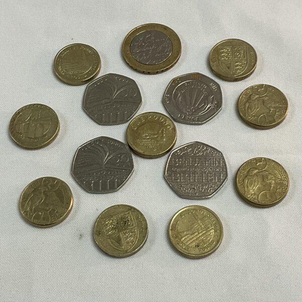 two pound coin nine one pound coins and four fifty pence commemorative coins