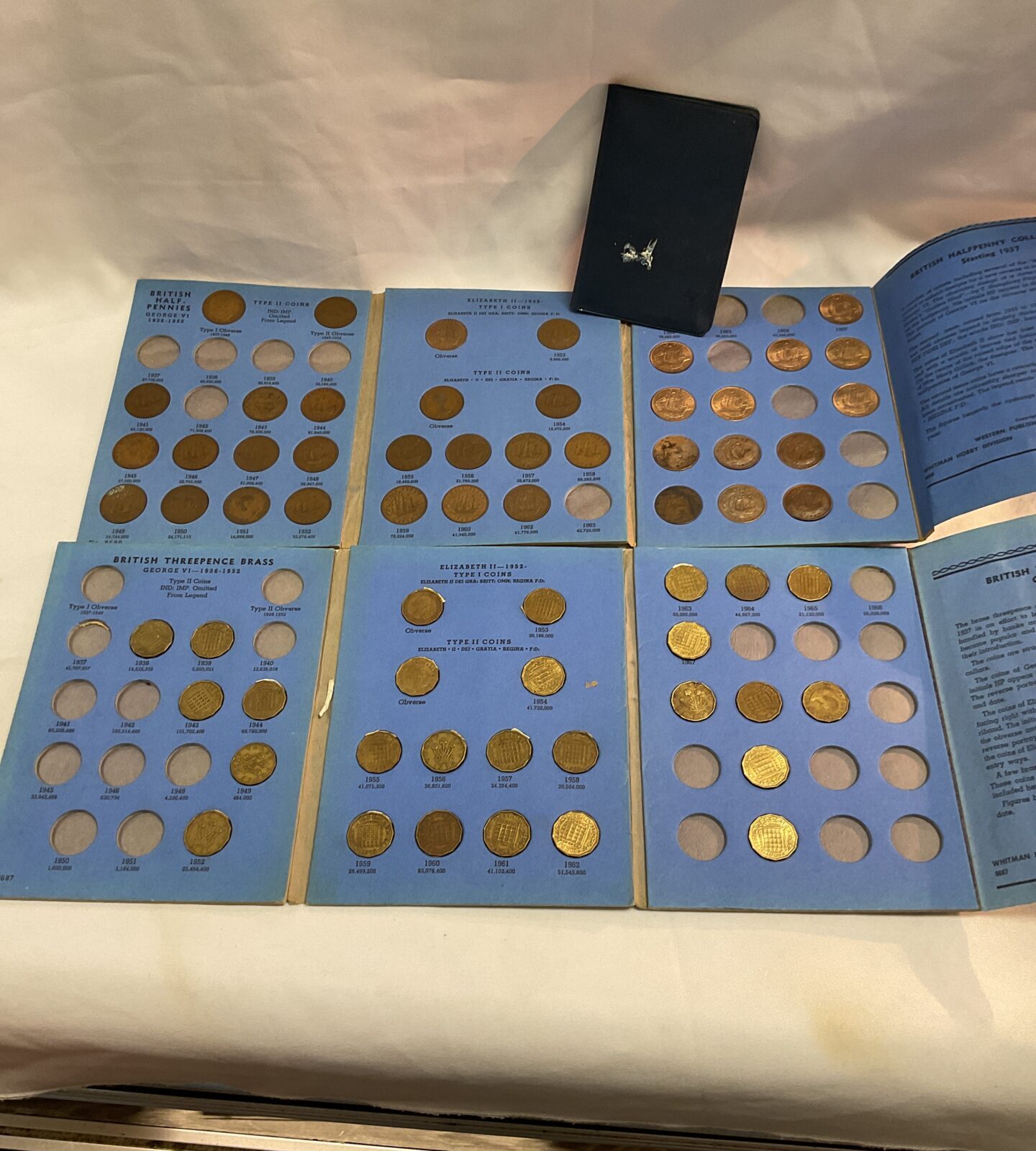 quantity of British coin collectors folders with some 3d and Half Penny  coins