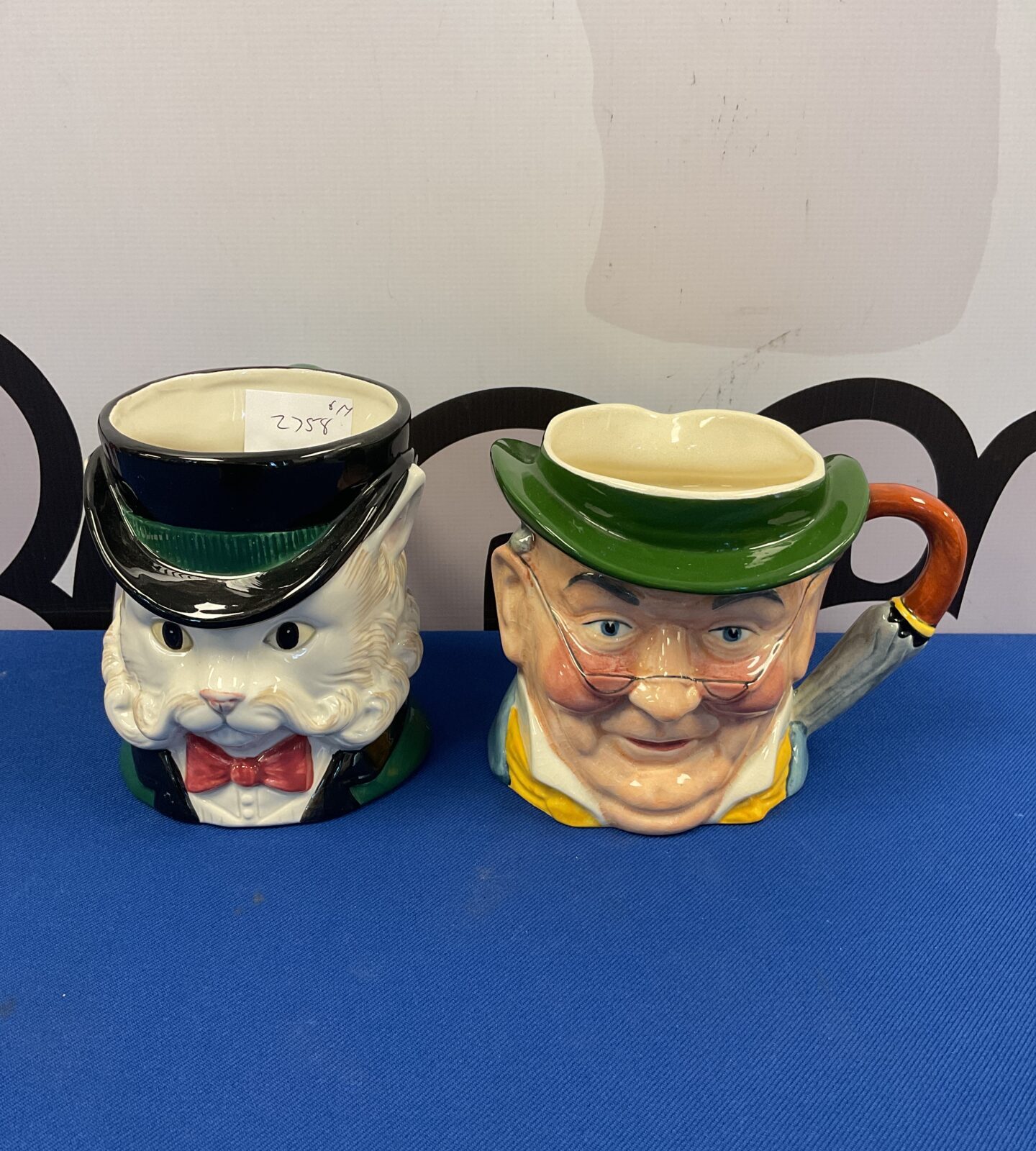 Two character jugs including ff gentleman cat & Staffordshire mr pickwick