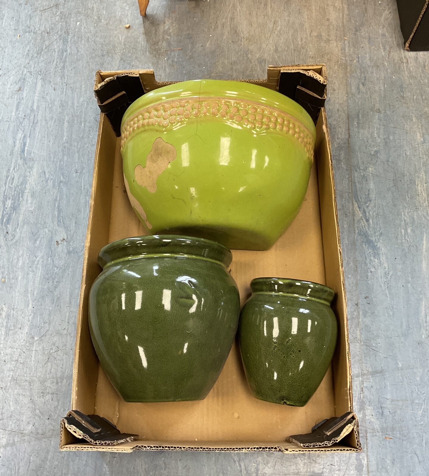 Three green glazed wall plant pots