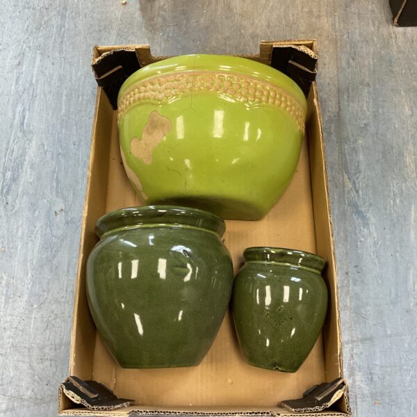 Three green glazed wall plant pots