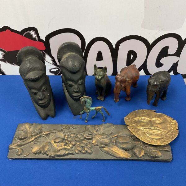 Pair of vintage carved wooden african busts with museum replica artifacts