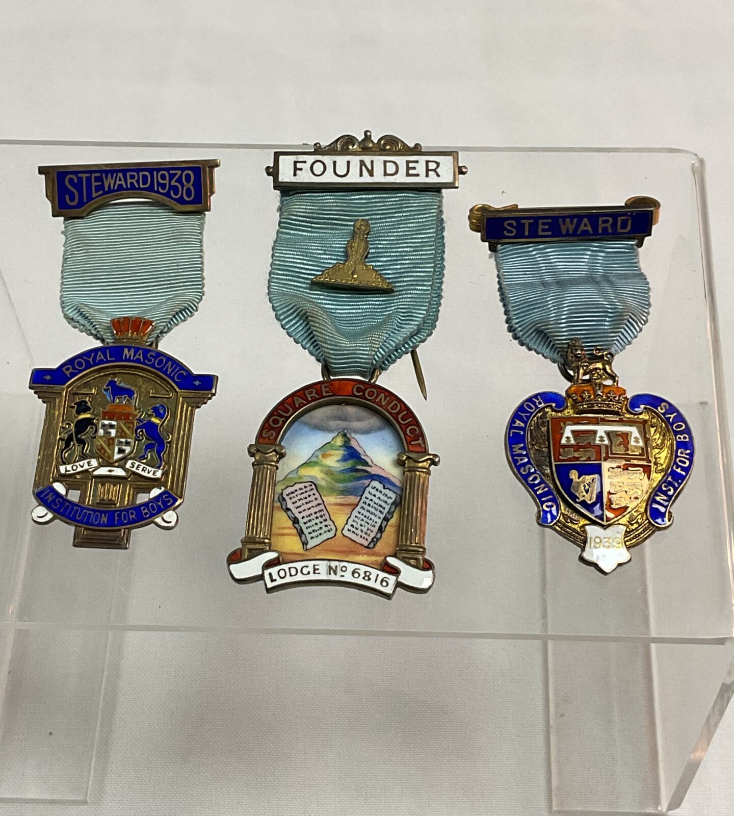 Three Masonic jewels two hallmarked silver steward and enamel founders jewel