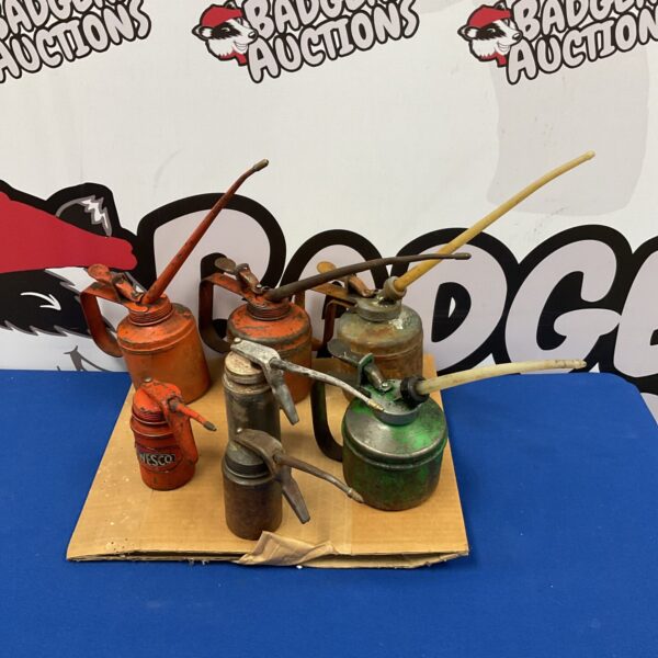 Collection of 7 vintage oil cans including wesco