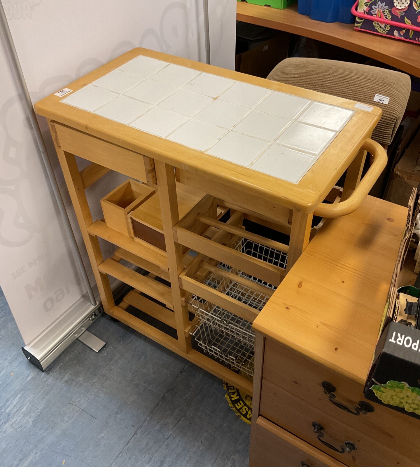 Beach effect tile topped kitchen trolley unit
