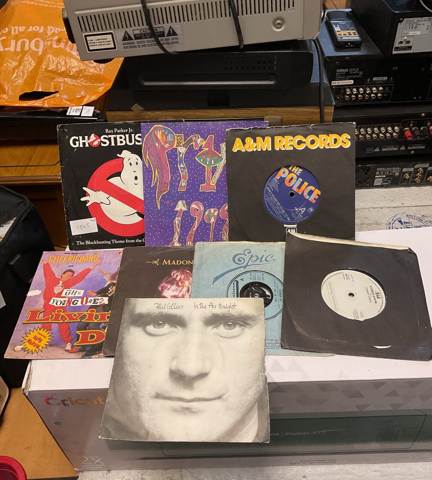 Selection of 7” single vinyl records including Madonna & ghostbusters