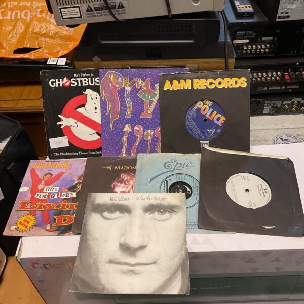 Selection of 7” single vinyl records including Madonna & ghostbusters