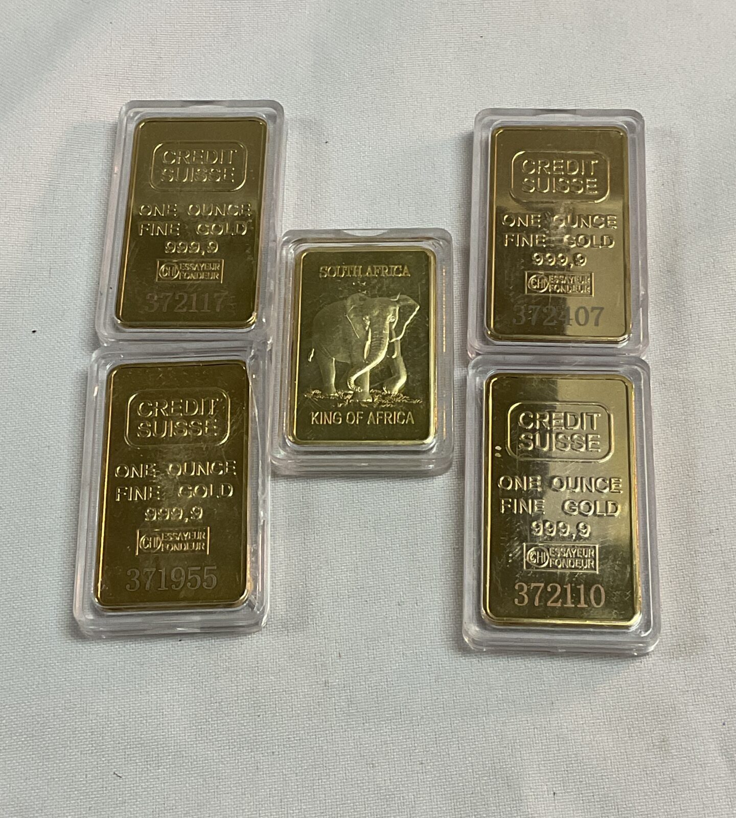 Four replica credit suisse one ounce commemorative gold bars and one king of Africa elephant Kruger and bar