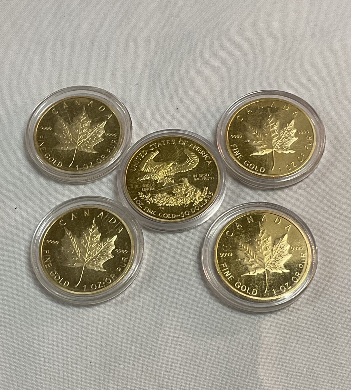 Four replica Canadian 50 dollars commemorative gold coins and USA  50 dollars coin