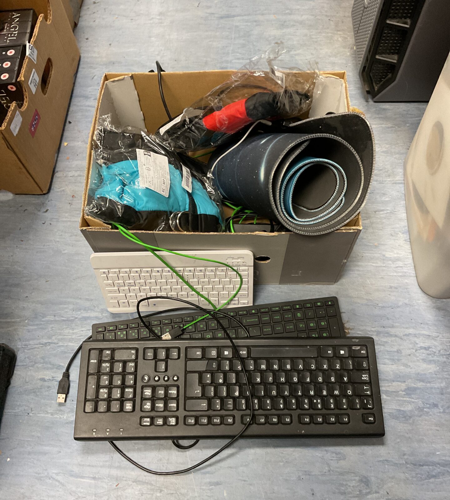 Box of mixed to include computer keyboards & new dog jackets