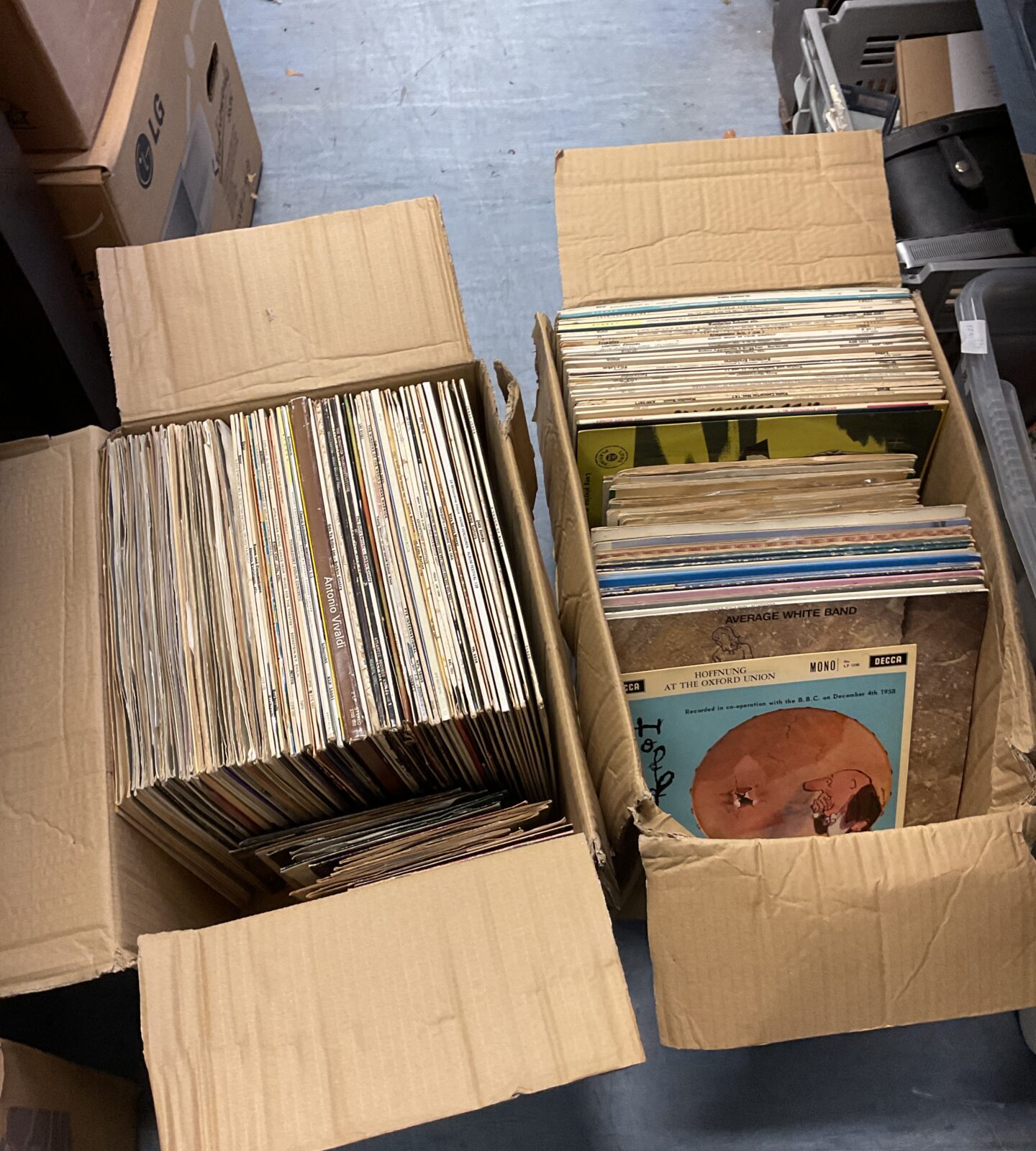 Two boxes of 12” & 7” vinyl records