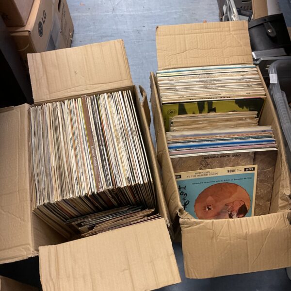 Two boxes of 12” & 7” vinyl records