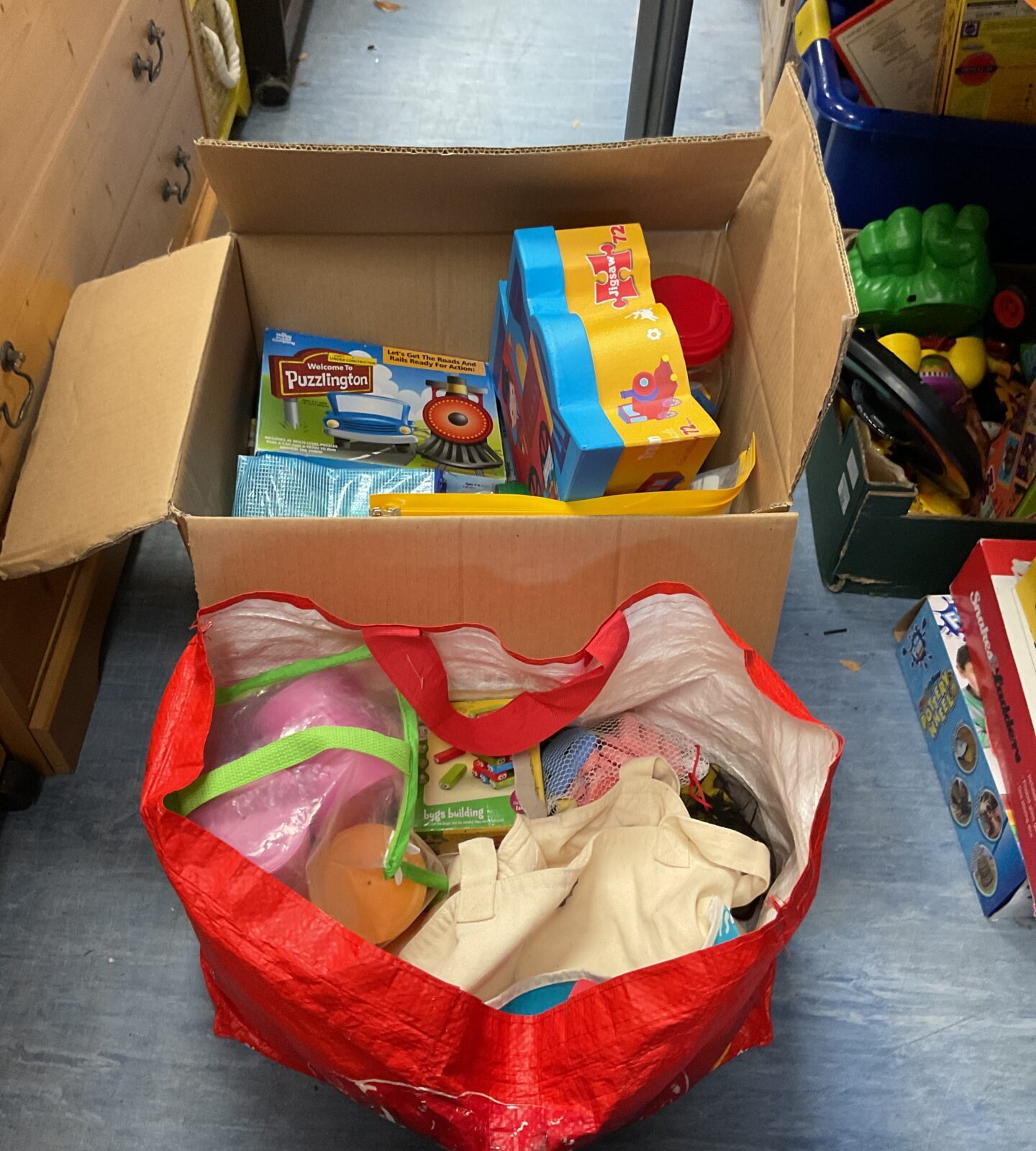 Box and bag of childrens toys and related items