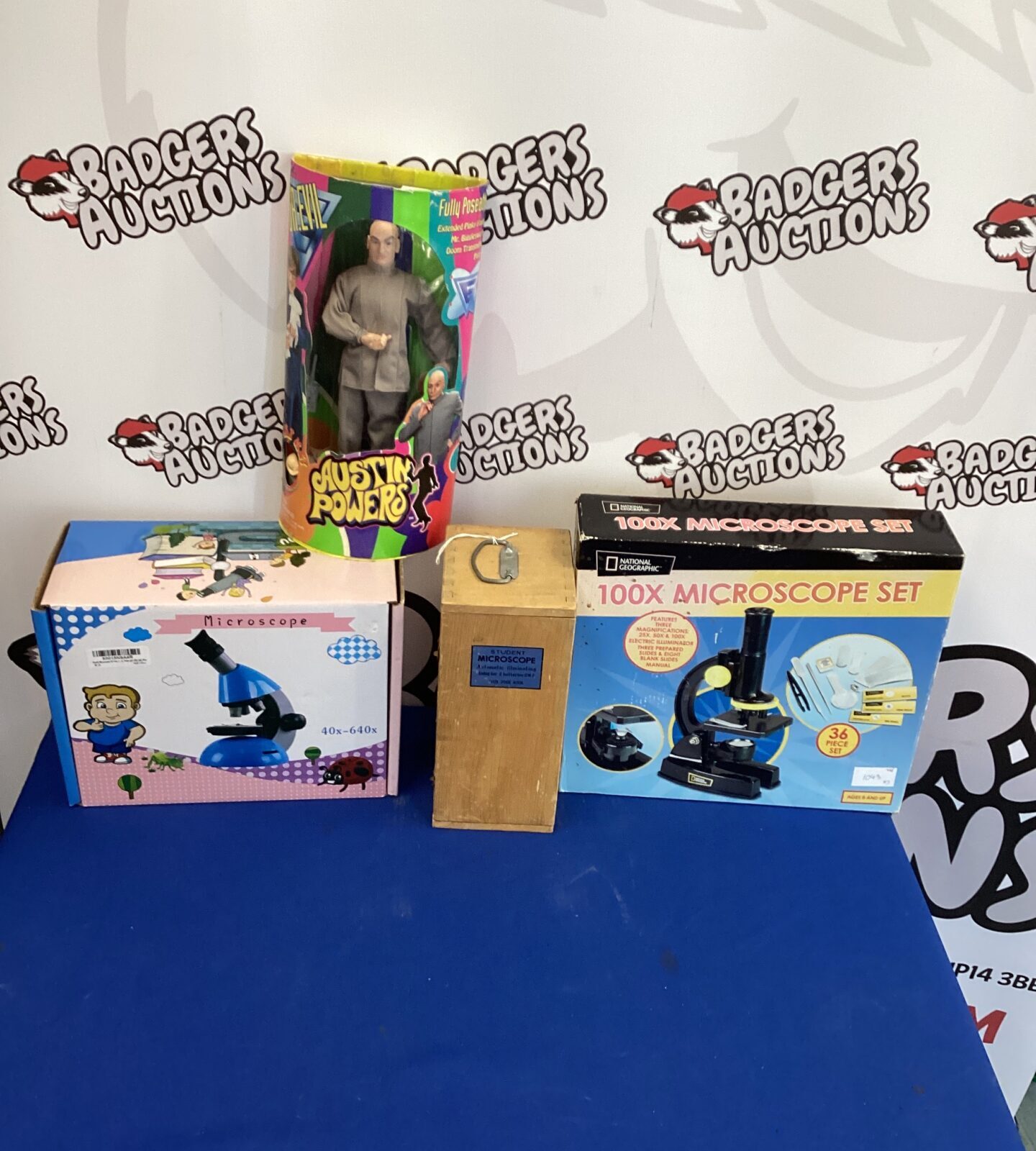 Three childs microscopes with Austin Powers Figure