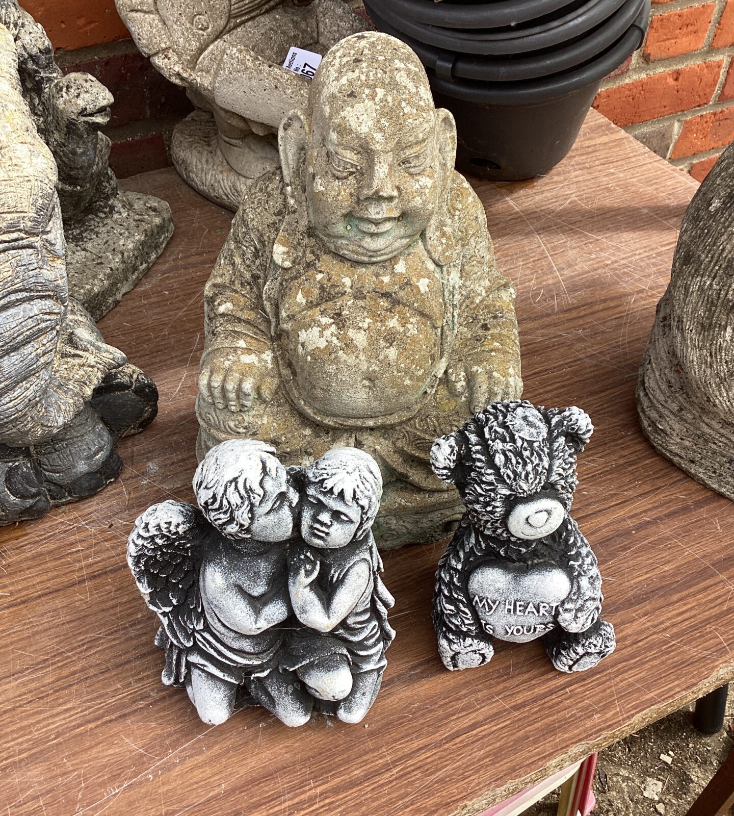 Buddha garden ornament with andles and teddy bear