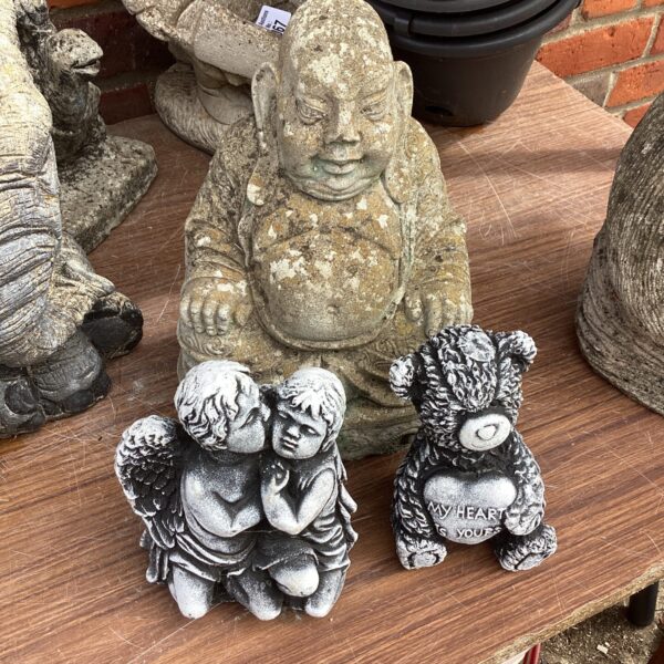 Buddha garden ornament with andles and teddy bear