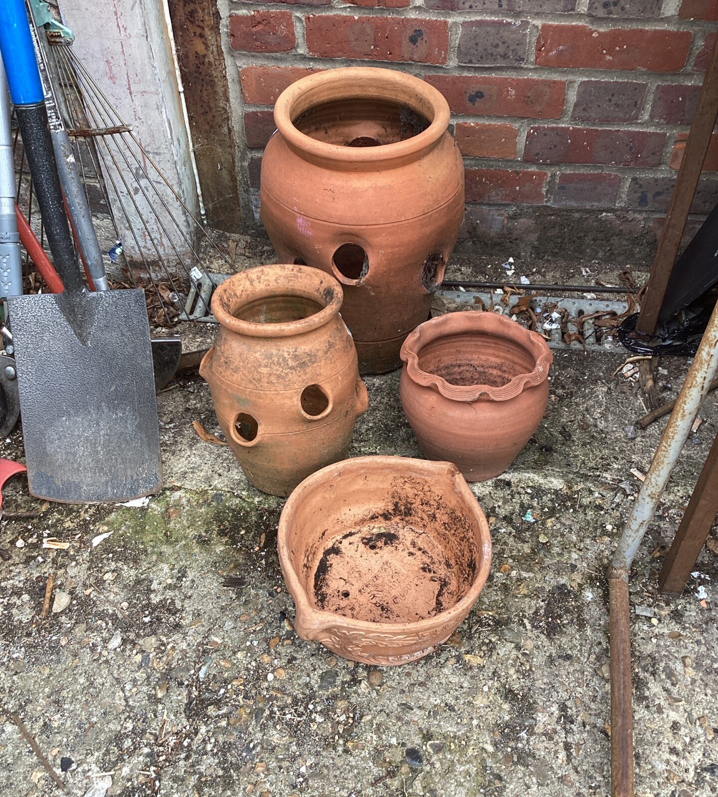 Four terracotta garden pots