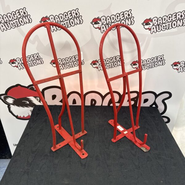 Two metal wall mounted horse saddle racks