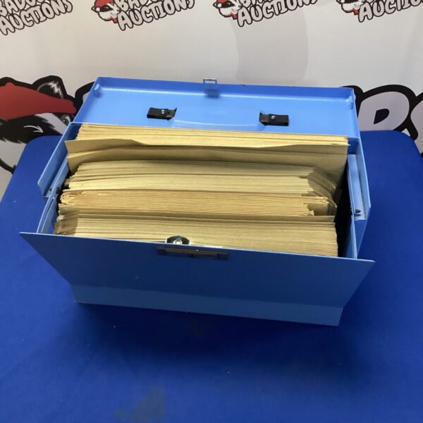 Metal filing box with brown envelopes inside