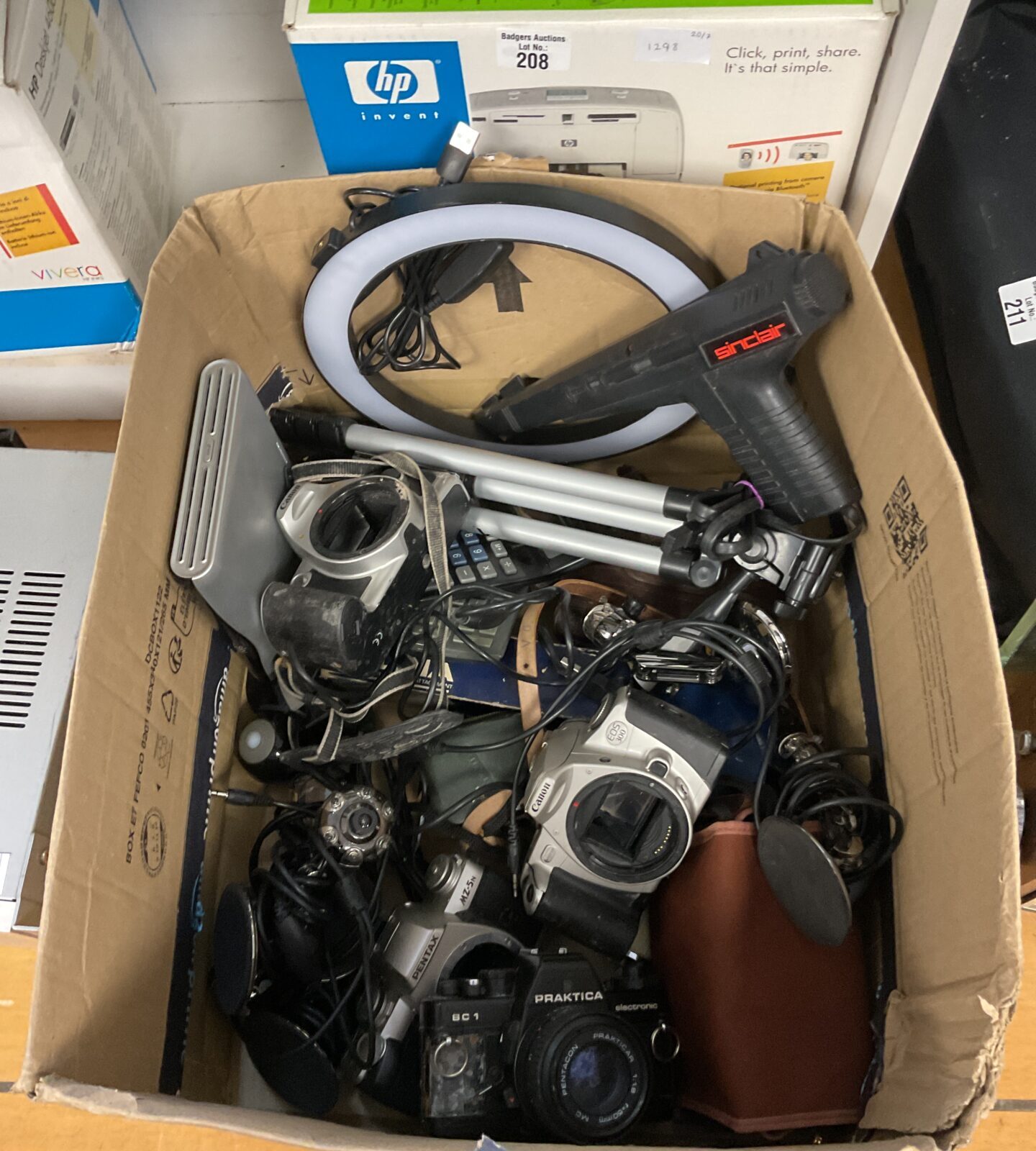 Box of cameras including canon & webcams with Sinclair light gun