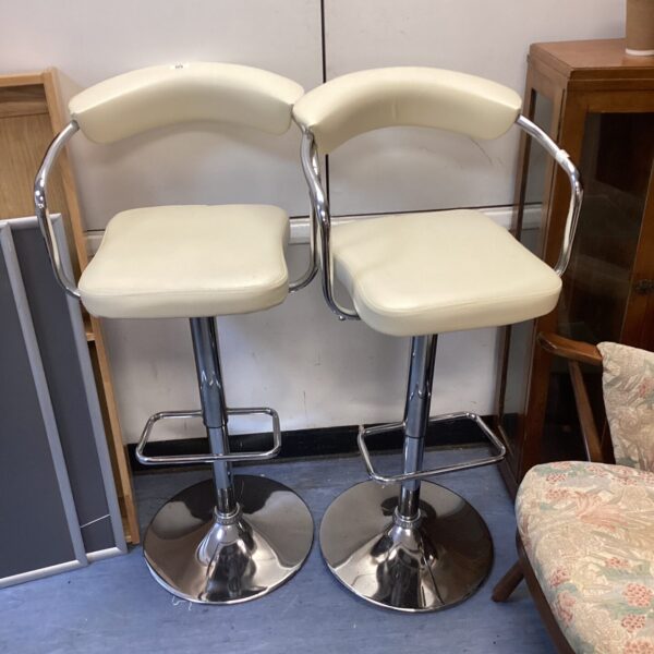 Two cream leather bar stools