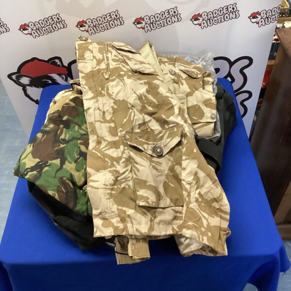 Military kit bag with assortment of british military clothing inc coat, shirts & polo shirt
